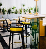 Chaise de bar Luc — smooth easy clean apricot, black lacquered wood structure and polished brass ring