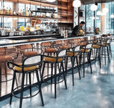 Chaise de bar Luc — smooth easy clean apricot, black lacquered wood structure and polished brass ring